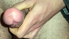 European amateur cock dripping sticky slidy precum in close-up view.