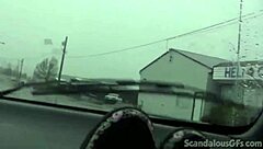 a redhead teen relaxes in the car outdoors