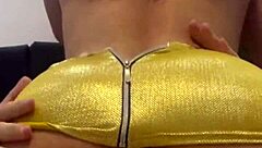 a curly-haired brunette dancing funk in a mini skirt provokes a young guy