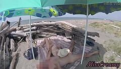 On that nudist beach in Tenerife, the stepdaughter casually jerks her stepfather's cock without any shame around