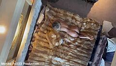 Naked Monika Fox poses seductively on a hotel bed, revealing big tits and tattooed ass