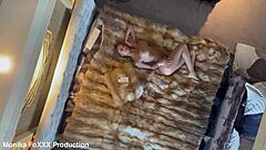 Naked Monika Fox poses seductively on a hotel bed, revealing big tits and tattooed ass