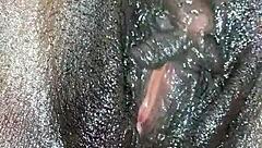 Black ebony woman masturbates in close up