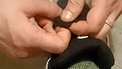 Why is my friend having so much fun trashing my sneakers? Provocative foot fetish scene.