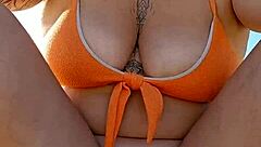 she flashes her tits on the beach to buy goods