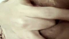 beautiful latina relaxes with self-massage on rainy afternoon