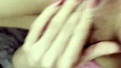 beautiful latina relaxes with self-massage on rainy afternoon