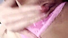 beautiful latina relaxes with self-massage on rainy afternoon