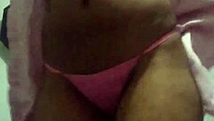 The black wife dances seductively for her lover on the marital bed, eager for his cum.