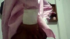 The black wife dances seductively for her lover on the marital bed, eager for his cum.