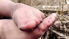 I’m obsessed with this goddess teasing her feet in tan pantyhose in the forest