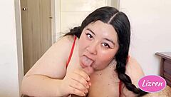 lizren gives a deepthroat blowjob during christmas, her curvy body on display