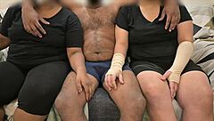 Detailed threesome where wife and friend give handjob in group scene.