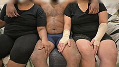 Detailed threesome where wife and friend give handjob in group scene.