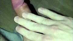 This young 18+ amateur guy starts massaging his huge cock solo, leading to intense orgasm and cum.