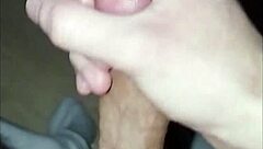 This young 18+ amateur guy starts massaging his huge cock solo, leading to intense orgasm and cum.