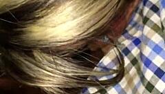 mature blonde interacts with young person in public outdoor setting