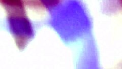 mature blonde interacts with young person in public outdoor setting