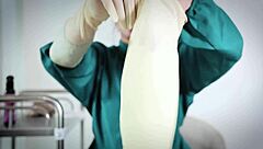 nurse uses latex gloves in hospital fetish play