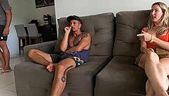 WIFE IN THE ROOM WITH FRIEND WHILE HUSBAND COOKS IN KITCHEN