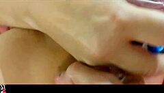 French amateur poses in black leather pants, satin zebra corset, pink satin panties, and heels.