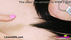 Sophisticated brunette model showcases her elegant figure on the sofa