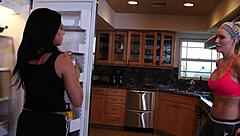 In a casual interracial scene, the blonde beauty and black-haired babe lick and finger each other using toys and shoes