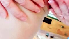 Mature woman spreads her huge pussy lips close-up