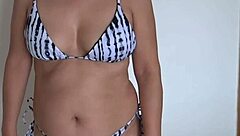 oh man, i'm this beautiful stepmother on the beach slipping into my bikini flashing big ass and hairy pussy looking for some guy to cuckold with