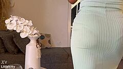 The crossdresser builds up to an intense climax and cums directly into a glass for display