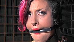 alt submissive gets clit paddling in bondage with heels and stockings