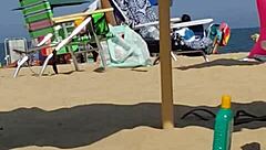 Hey, check this candid bikini slut at the beach 😏