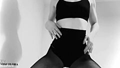 this brunette babe teases in fishnet tights, showing off her ass and feet. she poses in black and white for an interracial fetish vibe.