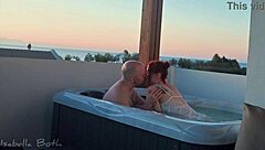 redhead couple starts kissing in jacuzzi then she sucks small cock underwater