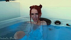 redhead couple starts kissing in jacuzzi then she sucks small cock underwater