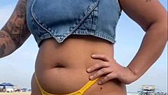 Teasing African Flasher Sparks Arousal On Sunny Beach With Bold Moves