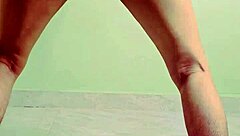 Young Indian teen bends over, showing wet pussy in solo play.