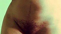 Young Indian teen bends over, showing wet pussy in solo play.