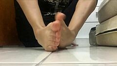Removing my black socks slowly while spitting on my teasing feet in this POV fetish session