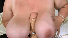 I adore my huge natural tits as Kiki Rainbow, fucking them with a dildo in chubby mature fun.