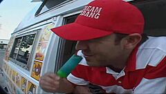 While flashing an upskirt view of her panties to the ice cream man in his truck.