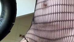 Athletic brunette milf dives into a fetish workout session with fishnets and fitness moves in her European housewife routine