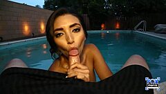 Frida Sante casually enjoys a lively evening by the pool with relaxing vibes.