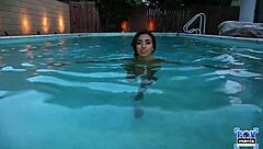 Frida Sante casually enjoys a lively evening by the pool with relaxing vibes.