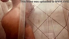 Why is this girl showing off her hairy pussy while being filmed in the shower?