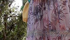 hairy mature woman strolls in a see-through dress, teasing with flashes of her body in public spots