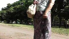 hairy mature woman strolls in a see-through dress, teasing with flashes of her body in public spots