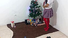 This mature student unwraps her Christmas gifts and enjoys masturbating with a dildo under spotlights in her uniform.