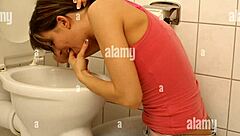 i uh, feel so sick in the bathroom, this girl is puking everywhere after trying to finger something out... it's messy