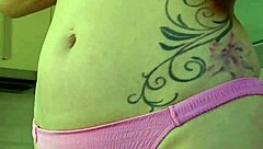 Rubbing suncream on tits during public sunbathing. Blonde housewife flashes petite body at the beach.